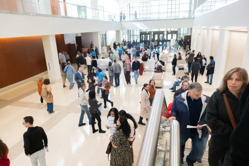 New western high school lobby filled with people.