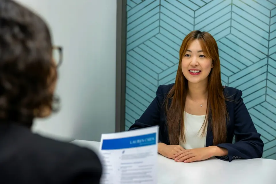 Job interview (photo via Resume Genius on Unsplash)