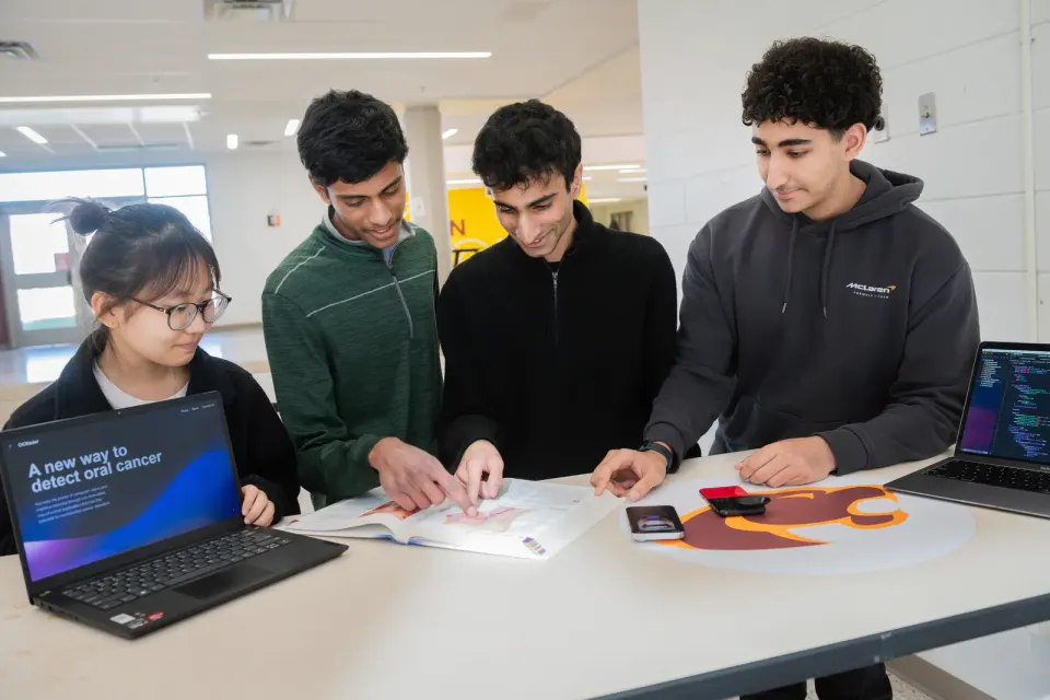 The four friends have been collaborating on the complex science and technology project.