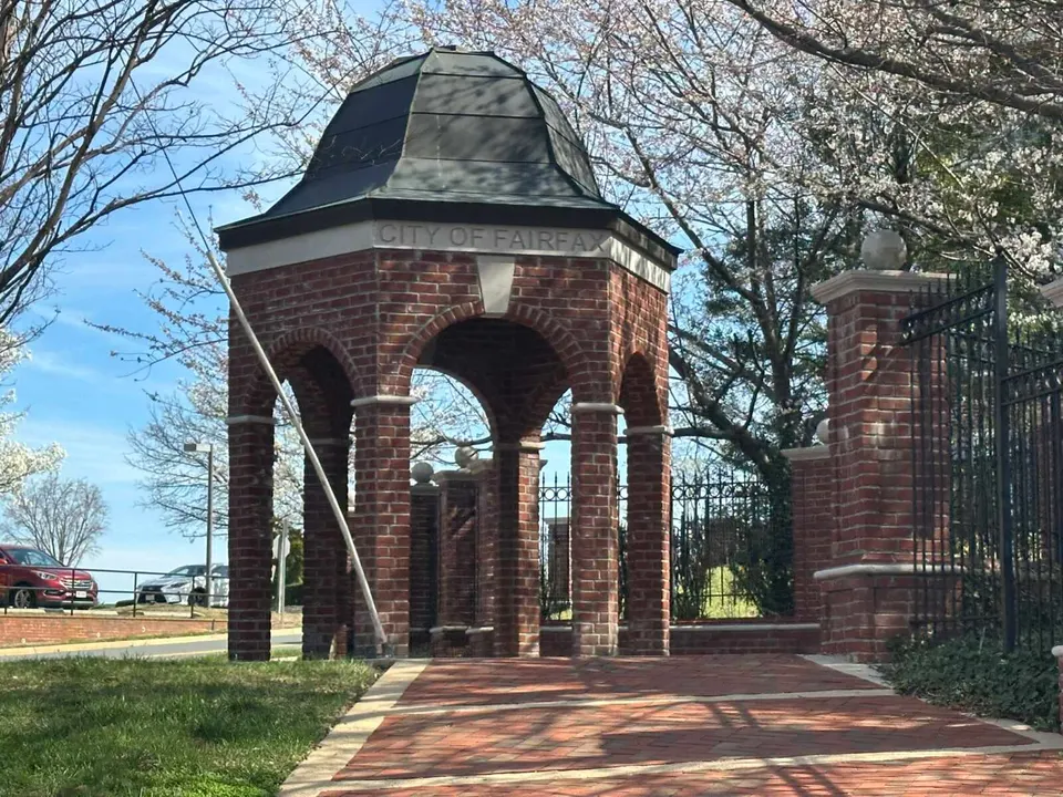 Brick City of Fairfax gazebo with emerging cherry blossoms (staff photo by Angela Woolsey)
