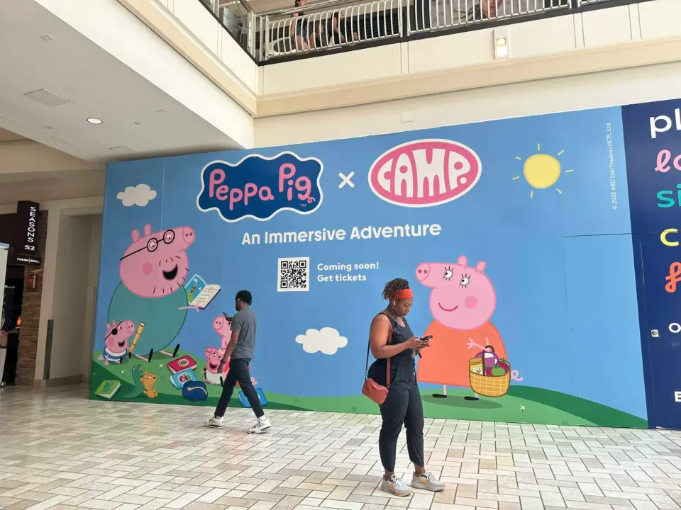Sign announcing Peppa Pig x Camp is coming to Tysons Corner Center (staff photo by Angela Woolsey)