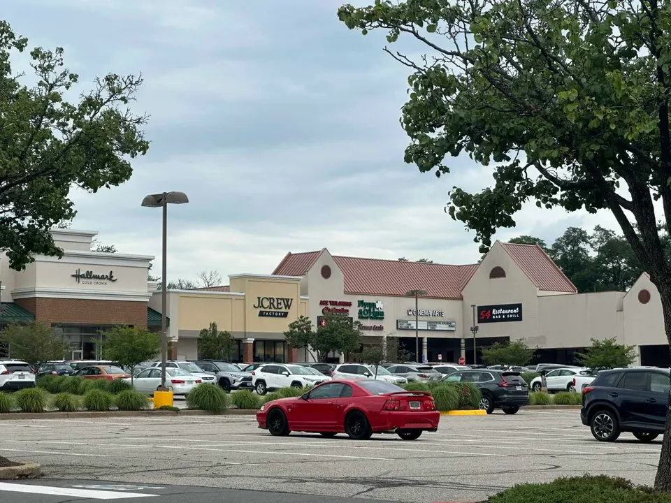 A red car parked at Fair City Mall in Fairfax City (staff photo by Angela Woolsey)