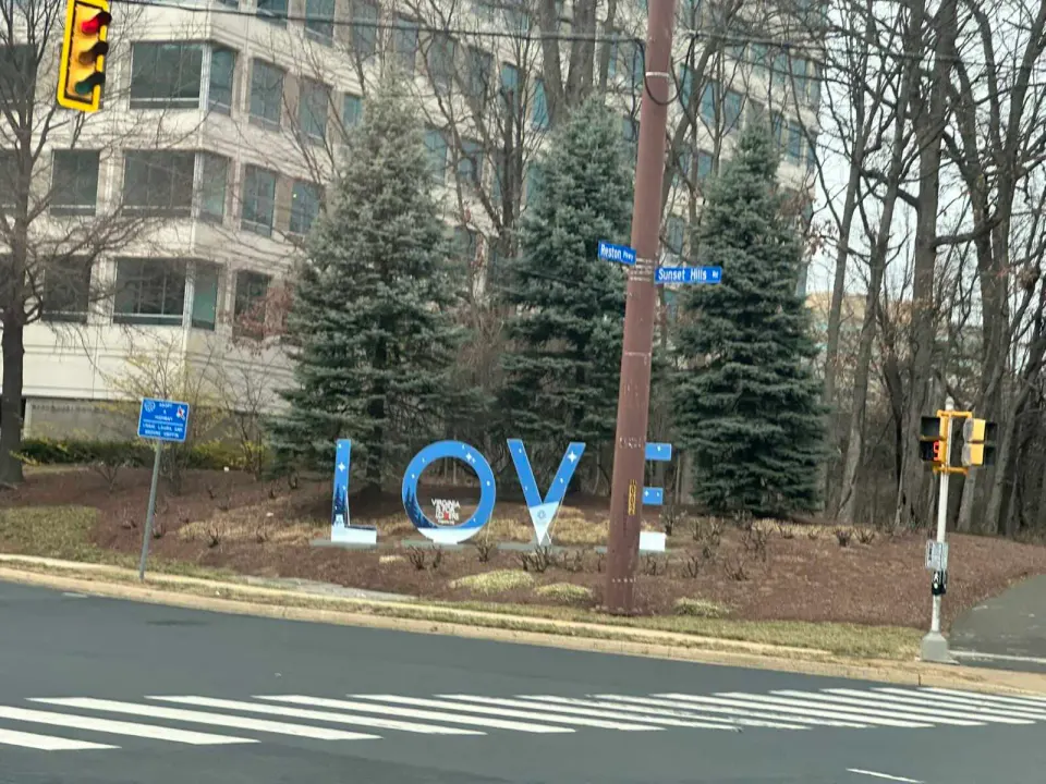A winter-themed LOVE sign at the corner of Reston Parkway and Sunset Hills Road (staff photo by Angela Woolsey)