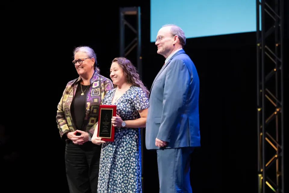 Liliana receives her honors award on stage