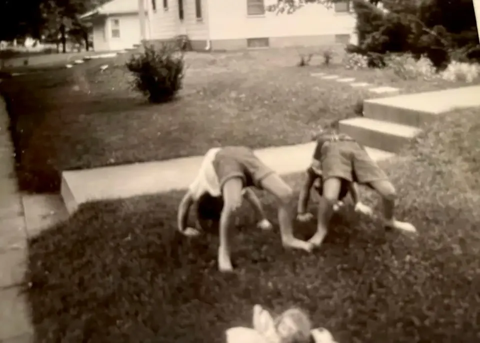 "There we are in the picture, doing backbends in her front yard...." Courtesy Carol McEwen.