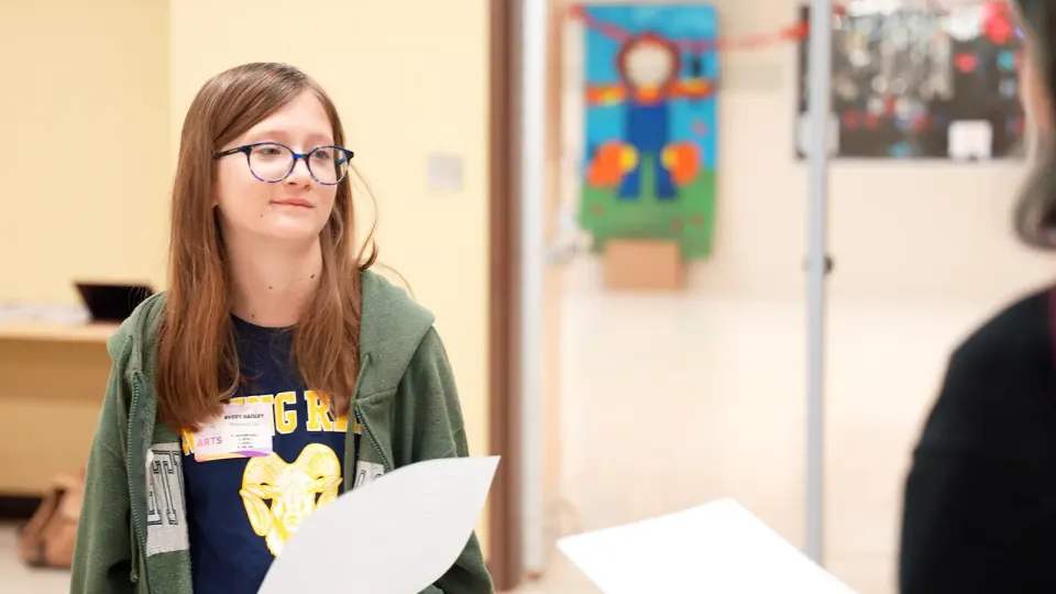 Student participates in a theatre directing workshop