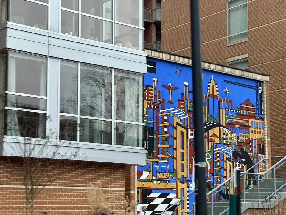 Passing Dana Ann Scheurer’s “Midtown Community Mural” at Reston Town Center (staff photo by Angela Woolsey)