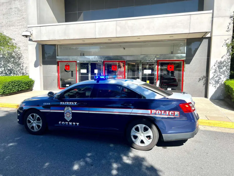 A Fairfax County police cruiser positioned outside the Tysons Corner Center Macy’s (staff photo by James Cullum)