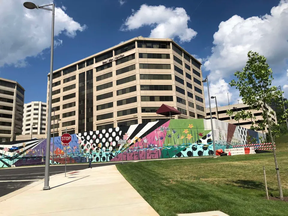 A mural surrounds the Booz Allen Hamilton headquarters in Tysons (staff photo by Angela Woolsey)