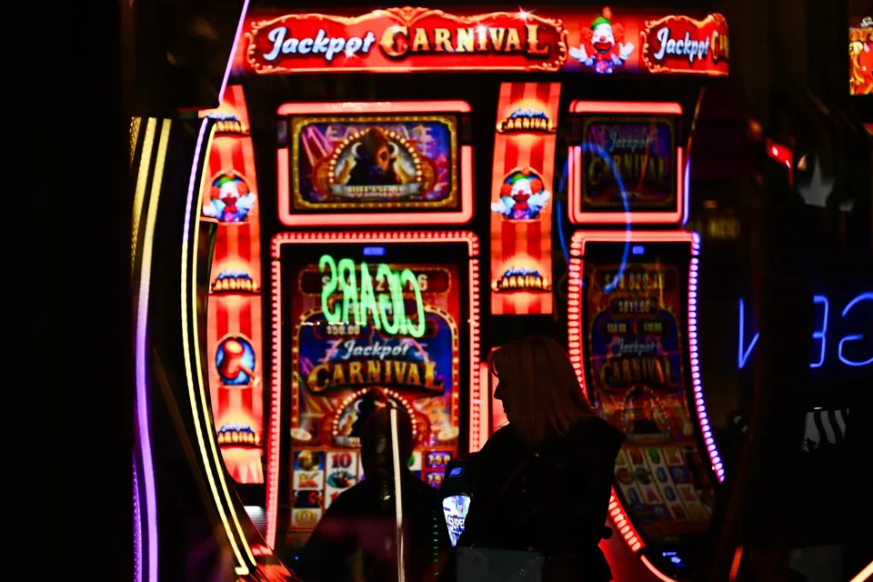 Customers use slot machines inside a casino ahead of a strike deadline for the Culinary Workers and Bartenders Unions contract…
