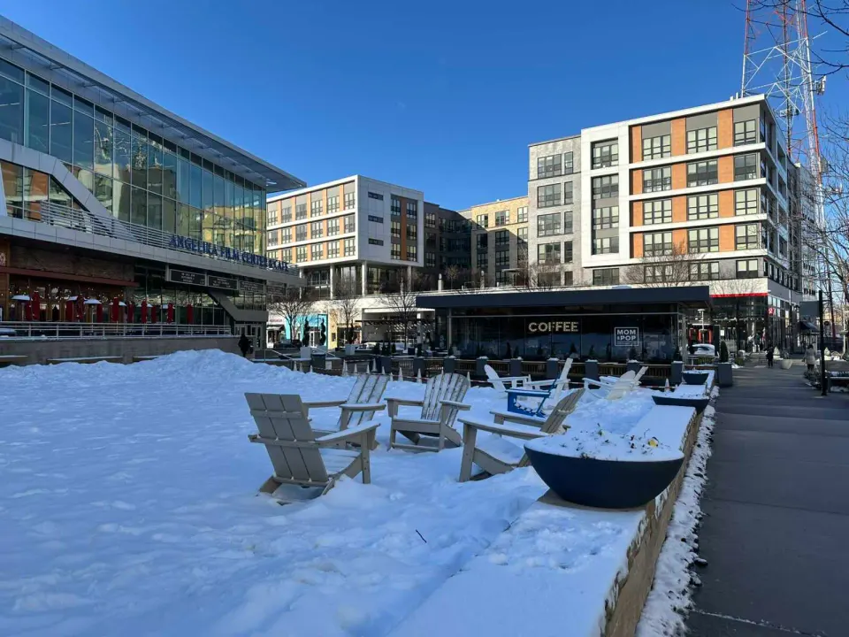 Lawn chairs in the snow at the Mosaic District in Merrifield (staff photo by Angela Woolsey)