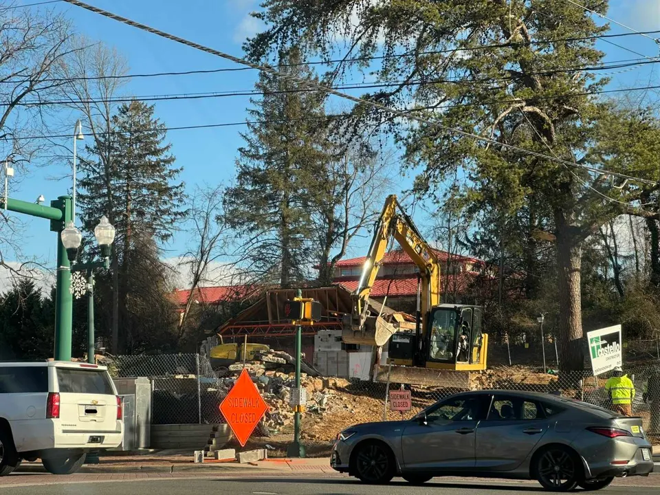 An excavator at work on the demolition of Patrick Henry Library in Vienna (staff photo by Angela Woolsey)
