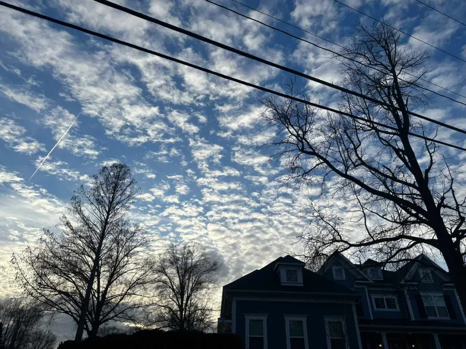 Clouds in the sky above a Vienna neighborhood (staff photo by Angela Woolsey)