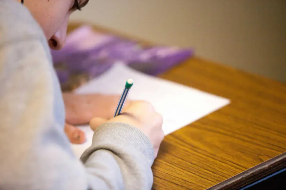 A student takes a school test (via Ben Mullins on Unsplash)