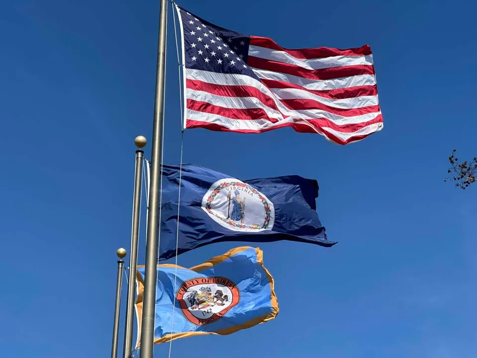 Waving U.S., Virginia and Fairfax County flags (staff photo by Angela Woolsey)