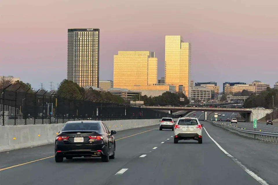 Driving east on the Dulles Access Road toward the Reston Town Center expansion at sunset (staff photo)