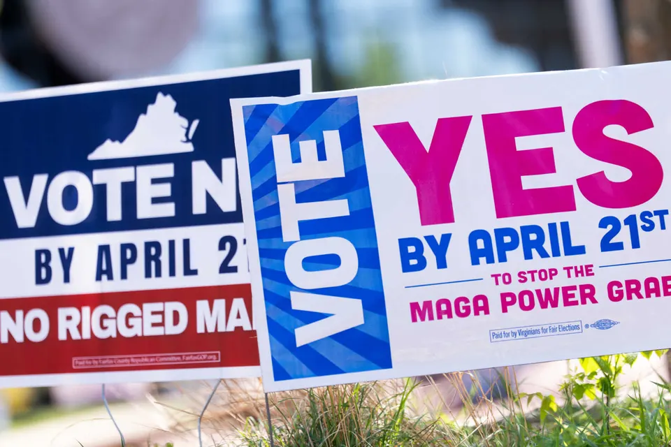 Signs are seen outside the Fairfax County Government Center during the Virginia redistricting referendum, Tuesday, April 21, 2026 (AP Photo/Julia Demaree Nikhinson)