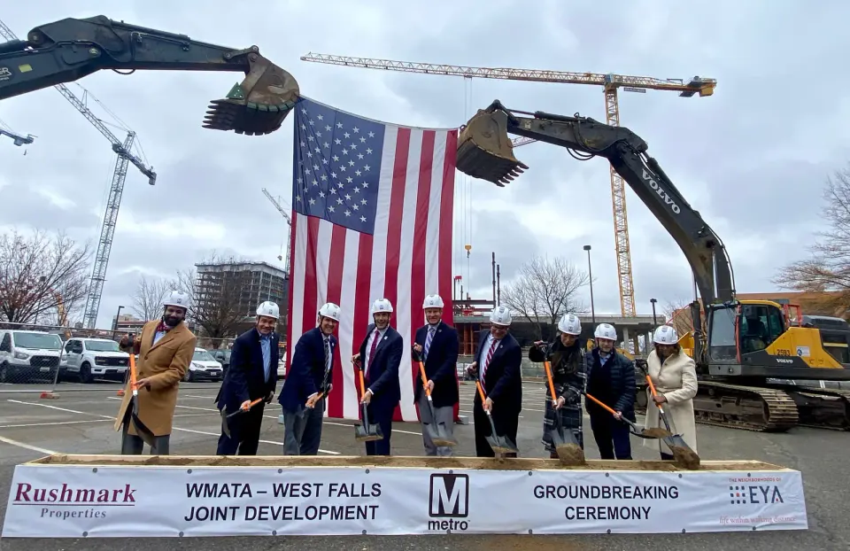 Fairfax politicians, Metro representatives, Rushmark Properties spokespeople, EYA officials, and City of Falls Church Mayor Letty Hardi (third from right) officially break...