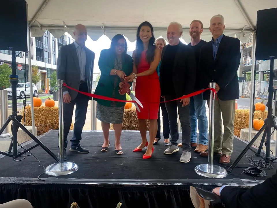 Sept. 25 'Grand Opening' ribbon-cutting for West Falls, a nearly 10-acre transit-oriented mixed-use neighborhood at 255 West Falls Station Blvd. Left-to-right: Partner at...