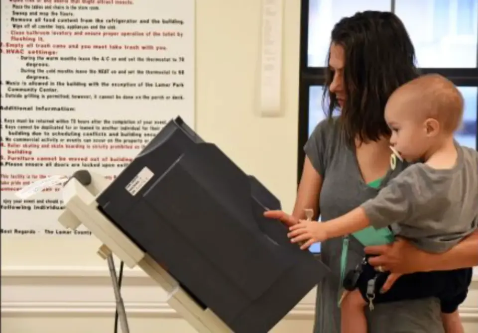 "I saw young moms with their kids in strollers, studying their sample ballots...." Photo by Susan Broadbridge. Courtesy USA TODAY.