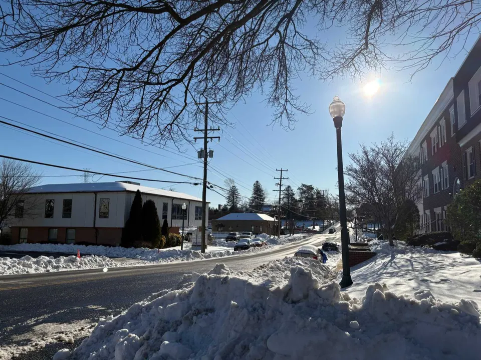 Some cars are blocked in by snow piled up along Center Street in Vienna (photo by Amy Woolsey)